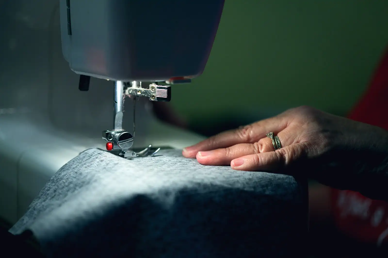 A tailor sewing by hand